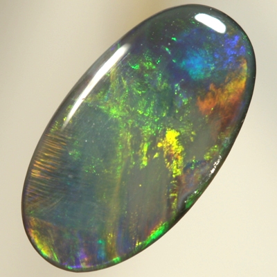SOLID BLACK OPAL Golden gem fire, oranges and greens with a touch of blue. SEE VIDEO